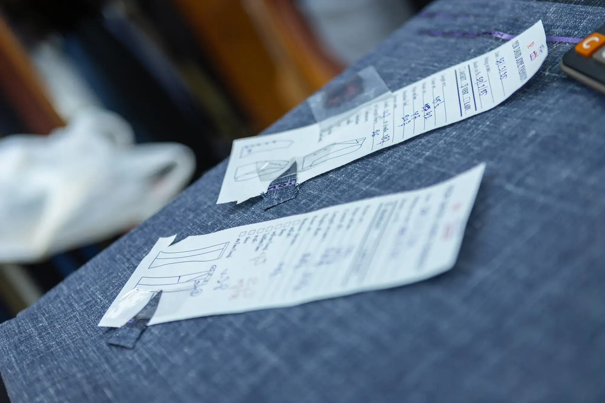 Precision measuring and pattern cutting for custom suits at New David Jone Fashion tailor Phuket Thailand