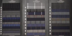 Open Luiciano All Seasons swatch book with navy, grey and checked Super 120s wool